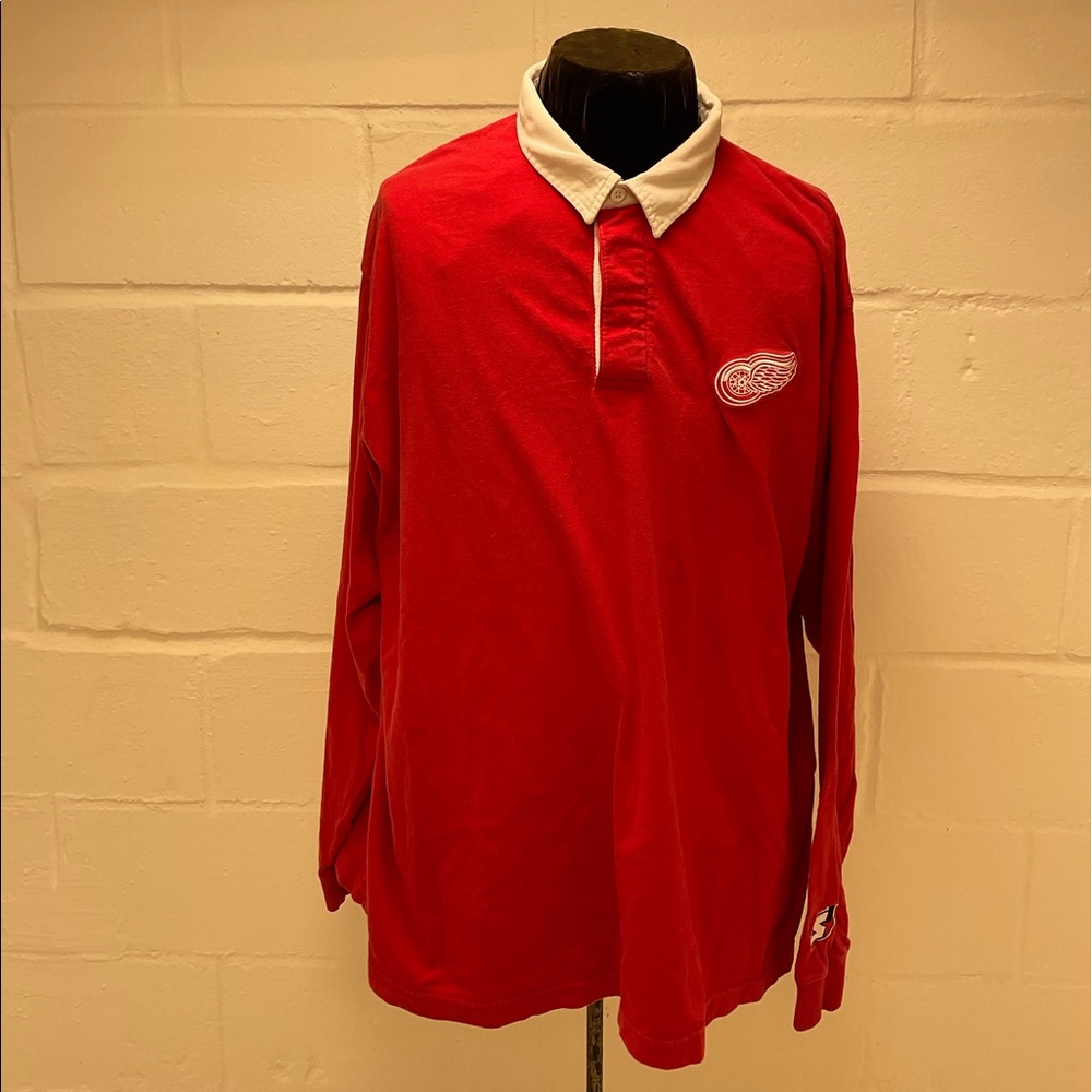 Super cool collared shirt made By starter. Size extra large red wings